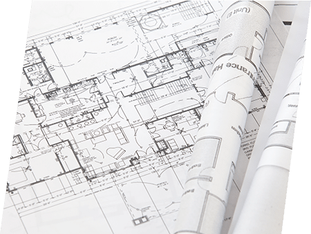 Photographie de plans d'étude du bâtiment. ATCE Énergie, spécialisée dans les installations de chauffage, ventilation, climatisation et plomberie, à Aix en Provence.